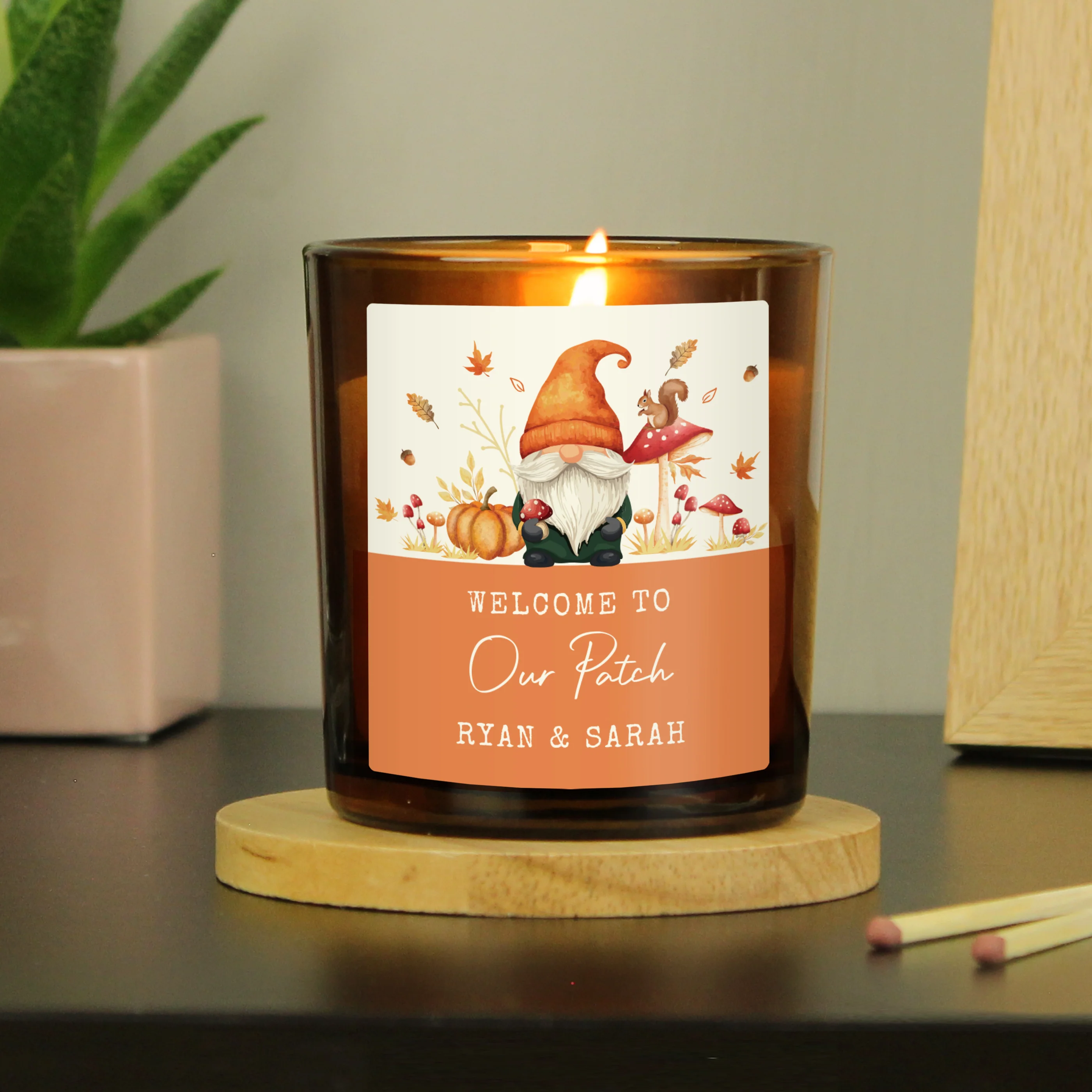Personalised Autumn Gonk Amber Glass Candle